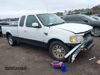 2003 Ford F-150 XL with VIN 1FTRX17W73NA42322, listed as a IAAI auction lot 41680100 with 129,295 mi miles. Bid and sale history available at carsss.com. Image 1.