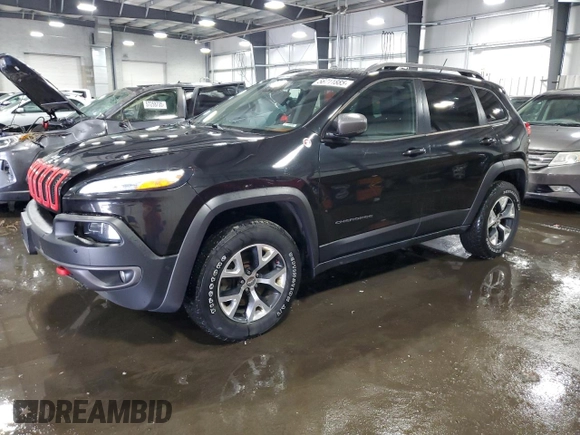 2014 Jeep Cherokee Trailhawk with VIN 1C4PJMBSXEW187981, listed as a Copart auction lot 56711885 with 157,317 mi miles and Salvage title. Bid and sale history available at DreamBid. Image 1.