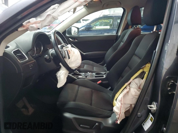 2016 Mazda CX-5 Touring z VIN JM3KE4CY5G0852073, wystawiony jako Copart lot #56599055 z przebiegiem 72 167 mil mil oraz Szkoda całkowita • Salvage title. Historia ofert i sprzedaży dostępna na DreamBid. Obrazek 7.