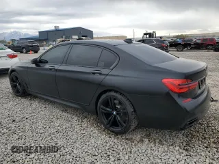 2018 BMW 7 Series 750i with VIN WBA7F0C55JGM23537, listed as a Copart auction lot 76824074 with 64,682 mi miles and Salvage Title. Bid and sale history available at carsss.com. Image 2.