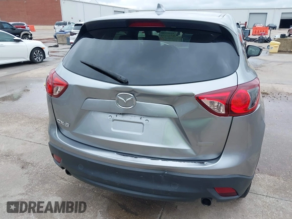 2014 Mazda CX-5 Touring z VIN JM3KE2CY8E0369145, wystawiony jako IAAI lot #42462985 z przebiegiem 155 480 mil mil oraz . Historia ofert i sprzedaży dostępna na DreamBid. Obrazek 18.