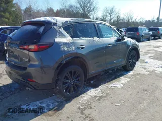 2022 Mazda CX-5 2.5 Turbo with VIN JM3KFBAY1N0526661, listed as a IAAI auction lot 41350659 with 22,963 mi miles and . Bid and sale history available at carsss.com. Image 4.