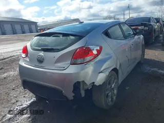2017 Hyundai Veloster with VIN KMHTC6AD6HU310694, listed as a IAAI auction lot 41734446 with 99,432 mi miles. Bid and sale history available at carsss.com. Image 4.