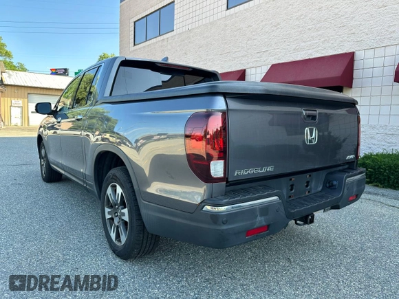 2019 Honda Ridgeline RTL-E with VIN 5FPYK3F71KB009532, listed as a Copart auction lot 65827935 with 217,177 mi miles and Clean title. Bid and sale history available at DreamBid. Image 3.