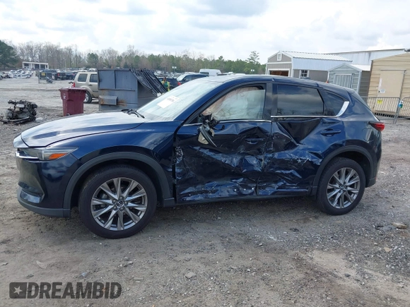 2021 Mazda CX-5 Grand Touring with VIN JM3KFBDM8M0484383, listed as a IAAI auction lot 41800786 with 58,617 mi miles. Bid and sale history available at carsss.com. Image 14.