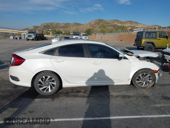 2017 Honda Civic EX z VIN 2HGFC2F76HH573639, wystawiony jako IAAI lot #41807311 z przebiegiem 140 431 mil mil oraz . Historia ofert i sprzedaży dostępna na DreamBid. Obrazek 13.