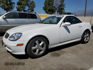 2001 Mercedes-Benz SLK-Class with VIN WDBKK65F81F210099, listed as a Copart auction lot 52606105 with 129,849 mi miles and Salvage Title. Bid and sale history available at carsss.com. Image 1.