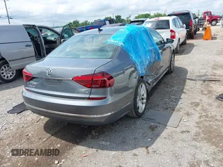 2017 Volkswagen Passat SE with VIN 1VWGT7A32HC061803, listed as a IAAI auction lot 42546429 with 68,093 mi miles and . Bid and sale history available at DreamBid. Image 3.