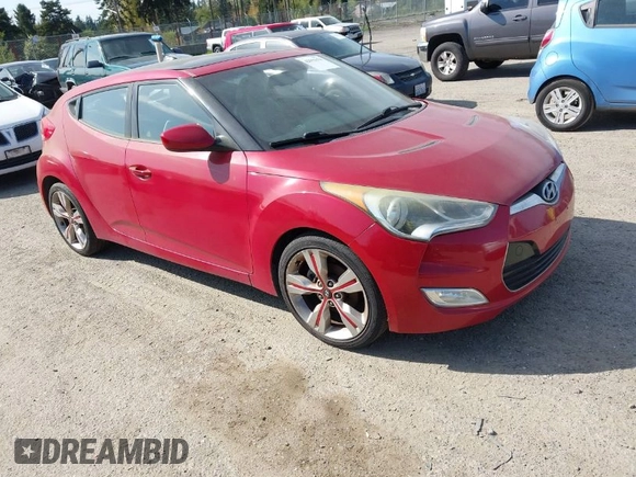 2012 Hyundai Veloster w/Black Int z VIN KMHTC6AD4CU077164, wystawiony jako IAAI lot #42053970 z przebiegiem 122 657 mil mil oraz . Historia ofert i sprzedaży dostępna na DreamBid. Obrazek 1.