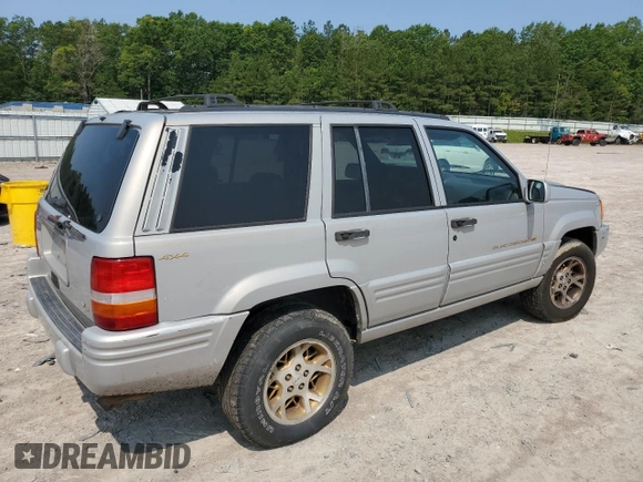 1998 Jeep Grand Cherokee Limited with VIN 1J4GZ78Y5WC324828, listed as a Copart auction lot 58992125 with 225,705 mi miles and Salvage title. Bid and sale history available at DreamBid. Image 3.