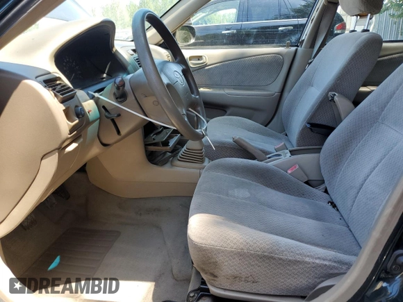 1999 Toyota Corolla VE with VIN 1NXBR12E7XZ240321, listed as a Copart auction lot 64259115 with 144,145 mi miles and Salvage title. Bid and sale history available at DreamBid. Image 7.