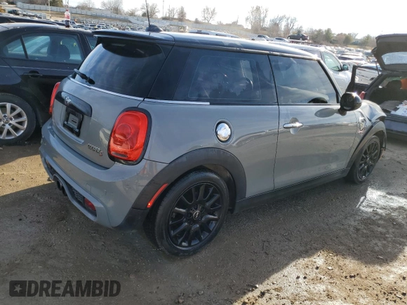 2014 MINI Hardtop S with VIN WMWXM7C57ET987816, listed as a Copart auction lot 41115434 with 122,724 mi miles and Salvage title. Bid and sale history available at DreamBid. Image 3.