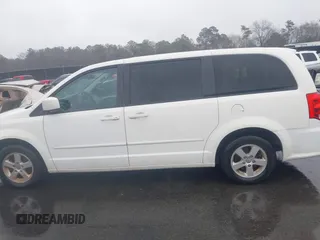 2012 Dodge Grand Caravan SXT with VIN 2C4RDGCG4CR304472, listed as a IAAI auction lot 41396437 with 180,309 mi miles and . Bid and sale history available at DreamBid. Image 14.