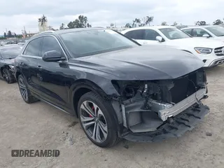2019 Audi Q8 Premium Plus z VIN WA1BVAF13KD044077, wystawiony jako IAAI lot #39445353 z przebiegiem 55 333 mil mil oraz . Historia ofert i sprzedaży dostępna na DreamBid. Obrazek 1.