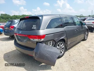 2014 Honda Odyssey Touring with VIN 5FNRL5H99EB138952, listed as a IAAI auction lot 42538833 with 146,959 mi miles and . Bid and sale history available at DreamBid. Image 4.
