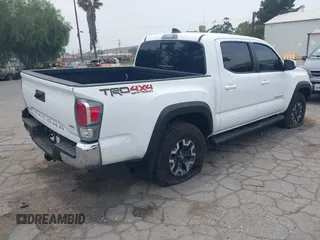 2023 Toyota Tacoma SR with VIN 3TMCZ5AN1PM556299, listed as a IAAI auction lot 42344160 with 42,338 mi miles and . Bid and sale history available at DreamBid. Image 4.