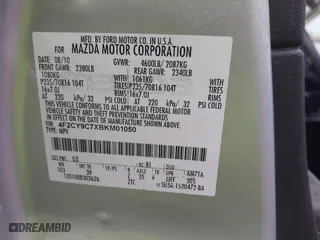 2011 Mazda Tribute Sport with VIN 4F2CY9C7XBKM01050, listed as a IAAI auction lot 41433870 with 122,287 mi miles. Bid and sale history available at carsss.com. Image 9.