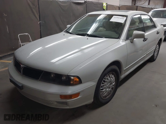 1999 Mitsubishi Diamante z VIN 6MMAP47P4XT003895, wystawiony jako IAAI lot #41992452 z przebiegiem 170 964 mil mil oraz . Historia ofert i sprzedaży dostępna na DreamBid. Obrazek 2.