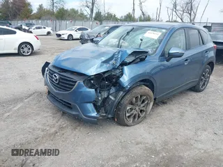 2016 Mazda CX-5 Grand Touring with VIN JM3KE4DY0G0629924, listed as a IAAI auction lot 41878154 with 78,196 mi miles. Bid and sale history available at carsss.com. Image 20.