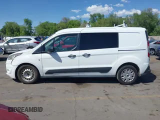 2015 Ford Transit Connect XLT z VIN NM0LS7F79F1203215, wystawiony jako IAAI lot #42217772 z przebiegiem 217 186 mil mil oraz . Historia ofert i sprzedaży dostępna na DreamBid. Obrazek 14.
