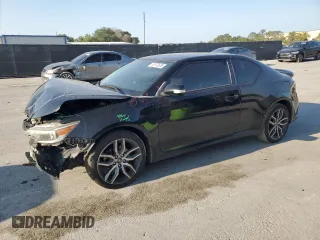 2015 Scion tC with VIN JTKJF5C79FJ003581, listed as a Copart auction lot 52973655 with 106,641 mi miles and Salvage Title. Bid and sale history available at carsss.com. Image 1.