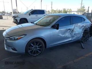 2018 Mazda 3 Touring with VIN 3MZBN1L31JM163466, listed as a IAAI auction lot 40777124 with 101,497 mi miles and . Bid and sale history available at carsss.com. Image 16.