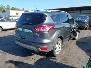 2016 Ford Escape Titanium with VIN 1FMCU9J94GUA63359, listed as a IAAI auction lot 41954514 with 94,315 mi miles. Bid and sale history available at carsss.com. Image 4.