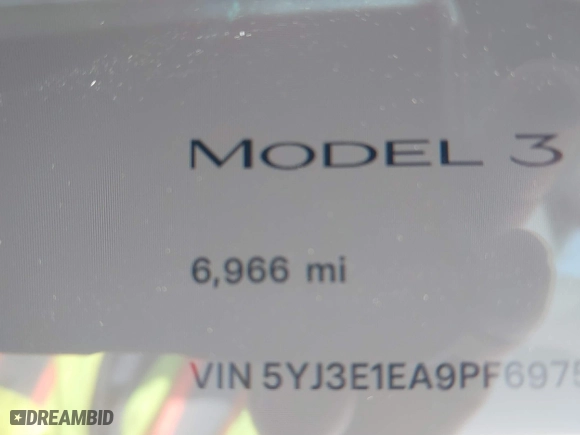 2023 Tesla Model 3 with VIN 5YJ3E1EA9PF697573, listed as a IAAI auction lot 41173833 with 6,966 mi miles. Bid and sale history available at carsss.com. Image 15.