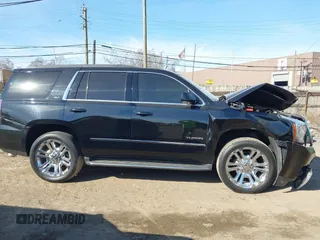2016 GMC Yukon SLT with VIN 1GKS2BKC5GR253038, listed as a IAAI auction lot 41790030 with 101,039 mi miles. Bid and sale history available at carsss.com. Image 13.