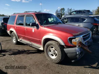 1999 Ford Explorer XLT with VIN 1FMDU34E7XZA60386, listed as a Copart auction lot 86851594 with 218,592 mi miles and Salvage title. Bid and sale history available at DreamBid. Image 4.