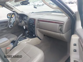 2004 Jeep Grand Cherokee Limited with VIN 1J4GX58SX4C255363, listed as a IAAI auction lot 42619798 with 239,475 mi miles and . Bid and sale history available at DreamBid. Image 5.