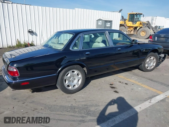 2003 Jaguar XJ 8 with VIN SAJDA14C03LF58706, listed as a IAAI auction lot 41619740 with 95,293 mi miles and . Bid and sale history available at DreamBid. Image 4.