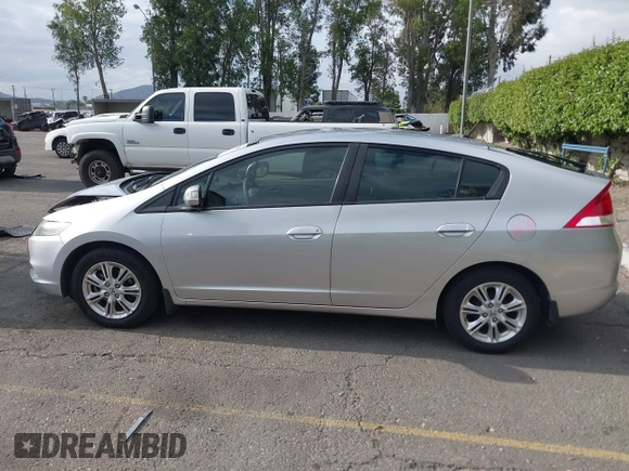 2010 Honda Insight EX with VIN JHMZE2H75AS003695, listed as a IAAI auction lot 42119429 with 90,901 mi miles and . Bid and sale history available at DreamBid. Image 14.