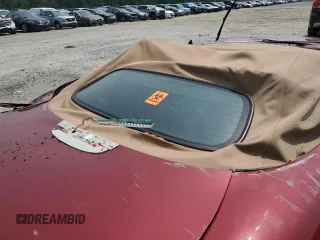 1999 Jaguar XK with VIN SAJGX204XXC038435, listed as a Copart auction lot 64843714 with Not Provided miles and Salvage Title. Bid and sale history available at DreamBid. Image 10.