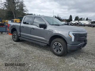 2023 Ford F-150 Lightning Pro with VIN 1FTVW1EL8PWG38419, listed as a Copart auction lot 47630535 with 11,940 mi miles and Salvage Title. Bid and sale history available at DreamBid. Image 4.