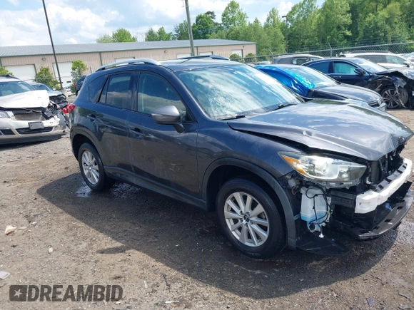 2015 Mazda CX-5 Touring with VIN JM3KE4CY9F0506879, listed as a IAAI auction lot 42209768 with 87,690 mi miles and . Bid and sale history available at DreamBid. Image 1.