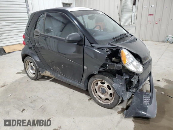 2011 Smart fortwo Pure с VIN WMEEJ3BA5BK480412, выставлен на аукционе Copart как лот 87023194 с пробегом 70 496 миль миль и Списание • Salvage title. История ставок и продаж доступна на DreamBid. Изображение 4.