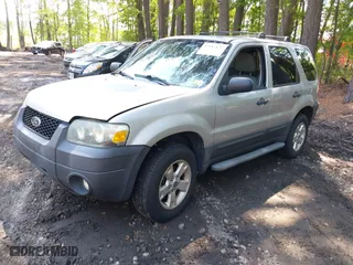 2007 Ford Escape XLT with VIN 1FMCU93167KA51832, listed as a IAAI auction lot 42115125 with 148,584 mi miles. Bid and sale history available at carsss.com. Image 2.