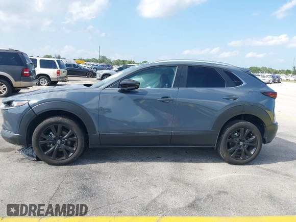 2023 Mazda CX-30 S Carbon Edition with VIN 3MVDMBCM4PM579080, listed as a IAAI auction lot 41941082 with 5,444 mi miles and . Bid and sale history available at DreamBid. Image 14.