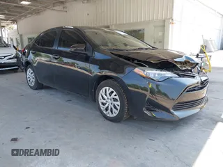 2018 Toyota Corolla L z VIN 5YFBURHE7JP785108, wystawiony jako IAAI lot #42230944 z przebiegiem 80 362 mil mil oraz . Historia ofert i sprzedaży dostępna na DreamBid. Obrazek 1.