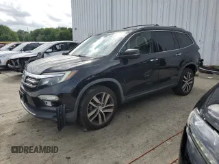 2017 Honda Pilot Touring with VIN 5FNYF6H96HB078514, listed as a Copart auction lot 63337215 with 137,897 mi miles and Salvage title. Bid and sale history available at DreamBid. Image 1.