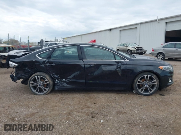 2020 Ford Fusion Titanium with VIN 3FA6P0D9XLR174523, listed as a IAAI auction lot 42100113 with 100,602 mi miles and . Bid and sale history available at DreamBid. Image 14.