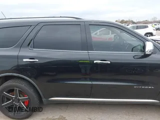2011 Dodge Durango Citadel with VIN 1D4SE5GTXBC695700, listed as a IAAI auction lot 41381731 with 152,055 mi miles. Bid and sale history available at carsss.com. Image 13.