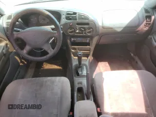 1998 Mitsubishi Mirage DE z VIN JA3AY26A6WU029219, wystawiony jako Copart lot #72253654 z przebiegiem Nie podano mil oraz Szkoda całkowita • Salvage title. Historia ofert i sprzedaży dostępna na DreamBid. Obrazek 8.