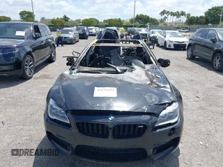 2019 BMW M6 z VIN WBS6E9C59KG808373, wystawiony jako IAAI lot #42170454 z przebiegiem Nie podano mil oraz . Historia ofert i sprzedaży dostępna na DreamBid. Obrazek 6.