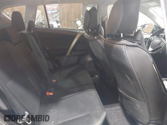 2018 Toyota RAV4 LE with VIN 2T3BFREV0JW759714, listed as a IAAI auction lot 41823084 with 119,909 mi miles and . Bid and sale history available at DreamBid. Image 8.