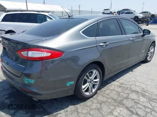 2016 Ford Fusion Titanium with VIN 3FA6P0SU1GR304590, listed as a IAAI auction lot 42381545 with 136,684 mi miles and . Bid and sale history available at DreamBid. Image 4.