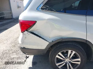 2018 Honda Pilot EX-L with VIN 5FNYF5H54JB009785, listed as a IAAI auction lot 41667784 with 67,296 mi miles. Bid and sale history available at carsss.com. Image 6.