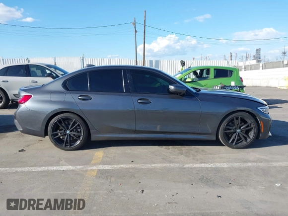 2021 BMW 3 Series 330i z VIN 3MW5R1J08M8B94401, wystawiony jako IAAI lot #41760747 z przebiegiem Nie podano mil oraz . Historia ofert i sprzedaży dostępna na DreamBid. Obrazek 13.
