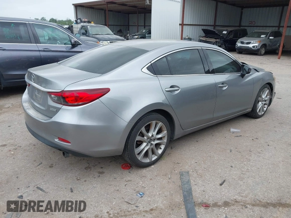 2014 Mazda Mazda6 i Touring with VIN JM1GJ1V59E1105417, listed as a IAAI auction lot 41963071 with 167,985 mi miles. Bid and sale history available at carsss.com. Image 4.